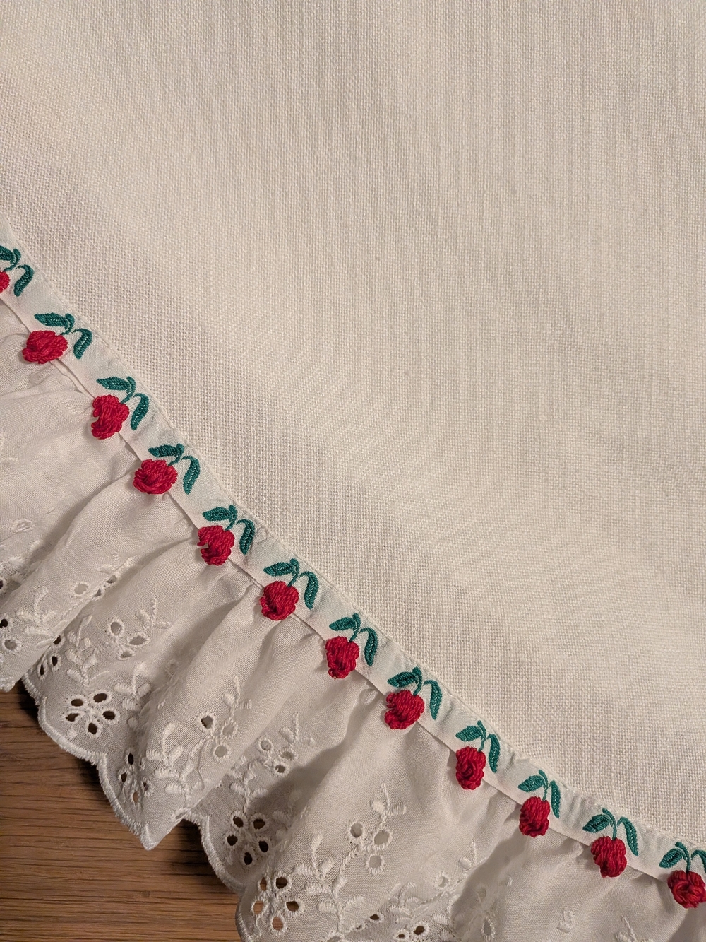 White Embroidered Ruffled Linen Tablecloth with Red Rose Trim